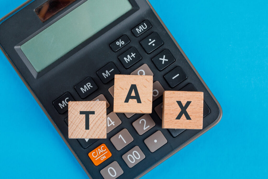 The word Tax written on wooden cubes