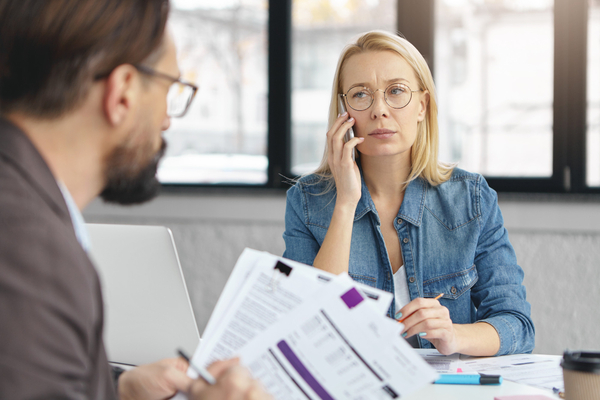 A tax lawyer talking to a woman