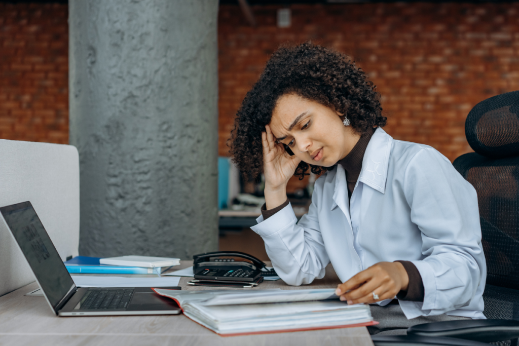 Person reading a book, appearing concerned about tax issues