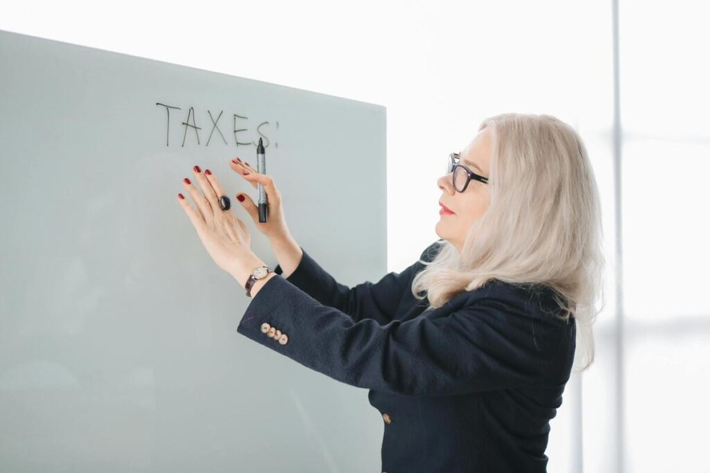 A woman writing about taxes