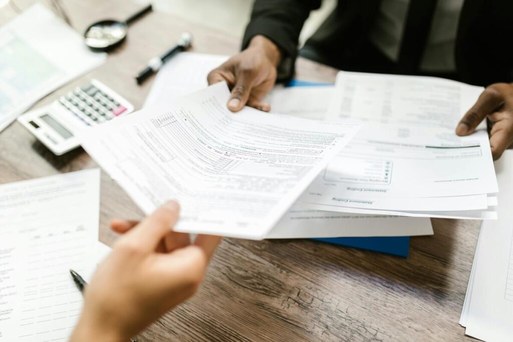 A person is handing out a tax form