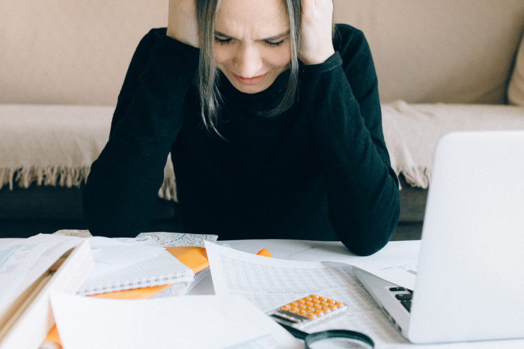 A woman looking sad after receiving news of her Offer in Compromise rejection